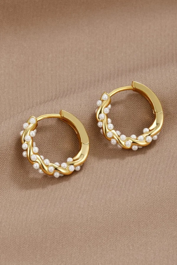 Gold hoop earrings with pearl accents, front view