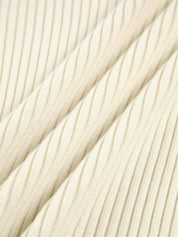 Cream ribbed polo top fabric texture, close-up