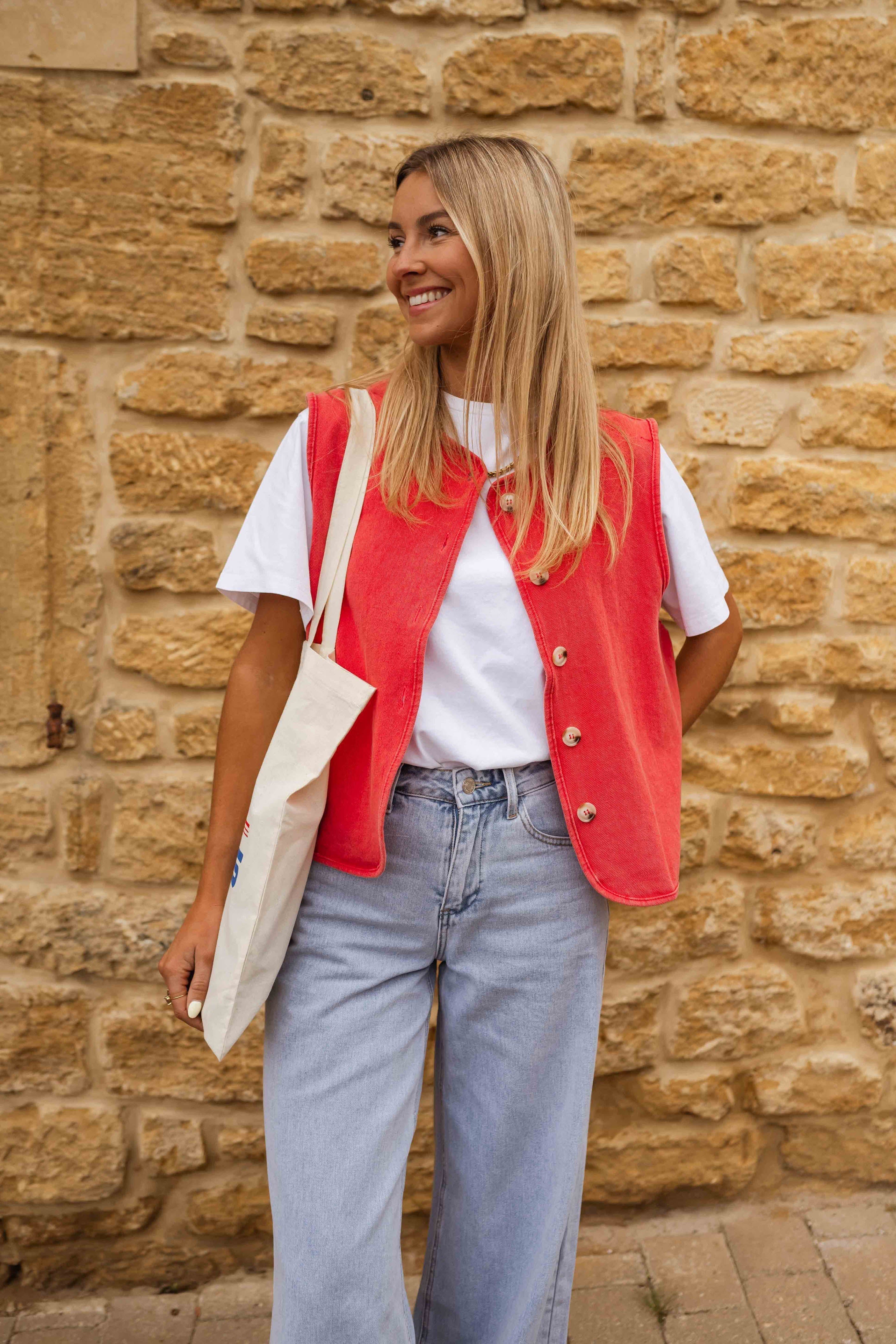 Red sleeveless gilet with buttons front view