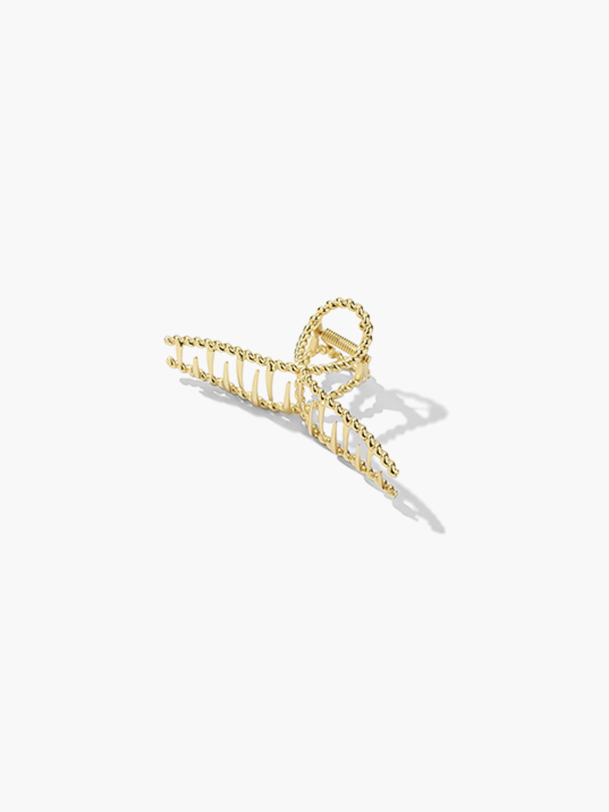 Gold metal hair clamp with twisted texture, front view isolated