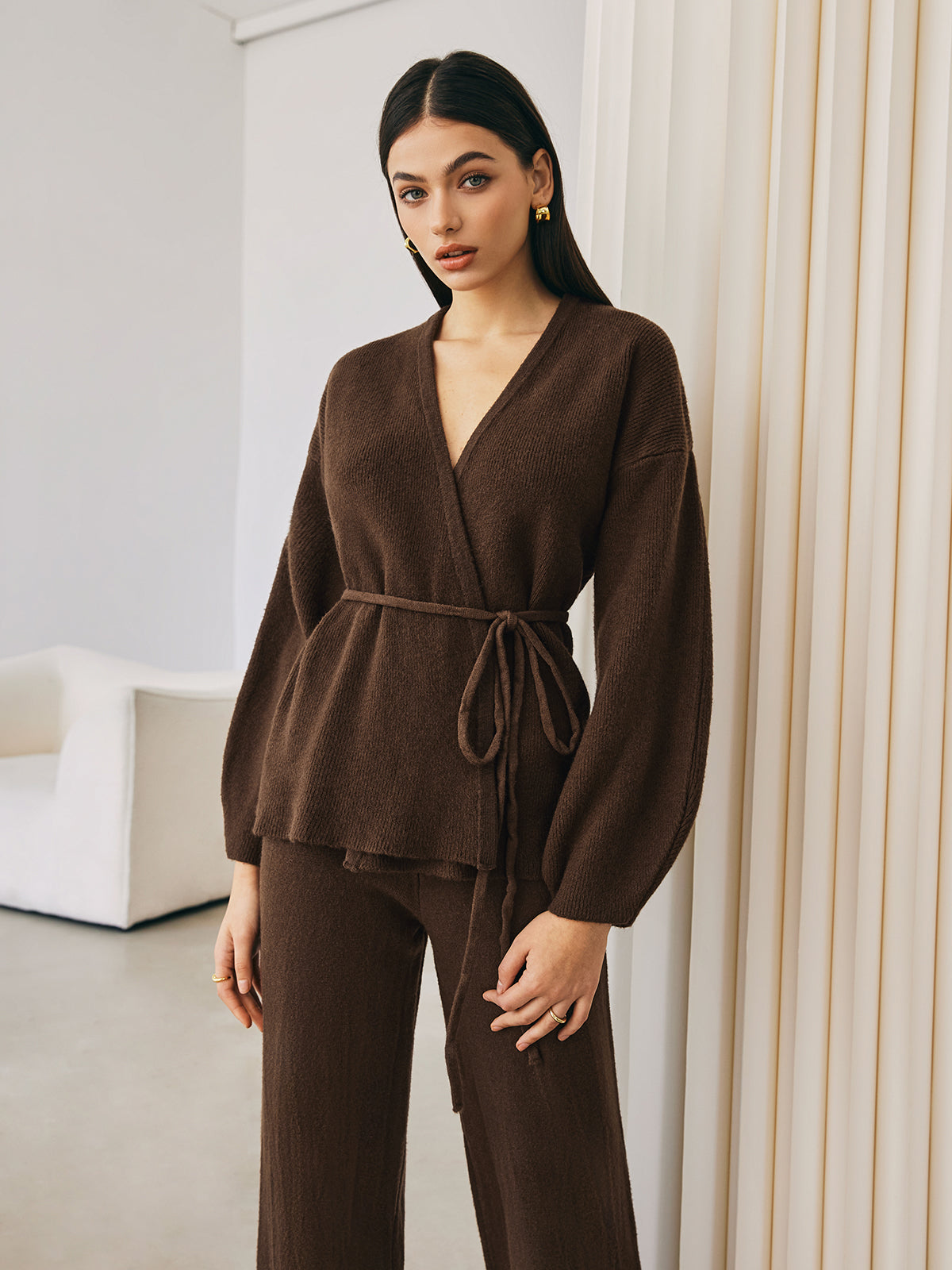 Brown knit wrap top and pants set, front view with hands on hips