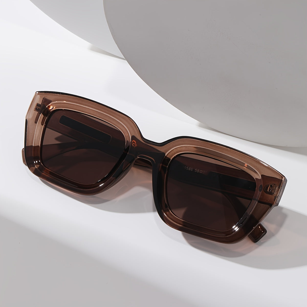 Sunglasses brown translucent square frame with metal temple accents side view