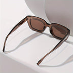 Sunglasses brown translucent square frame with metal temple accents angled view