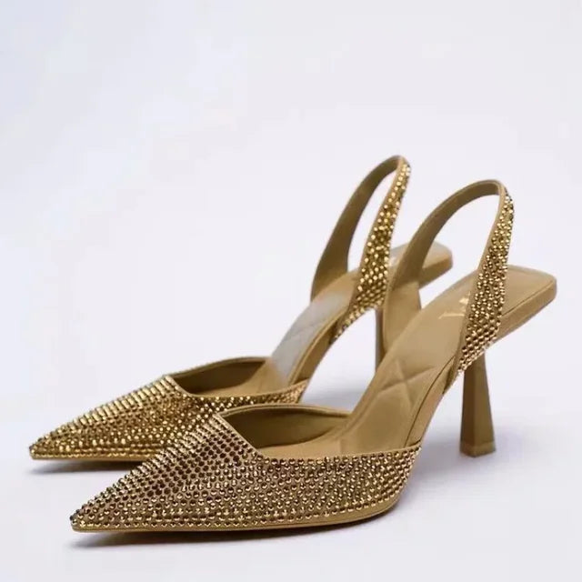 Gold glitter slingback heels front view