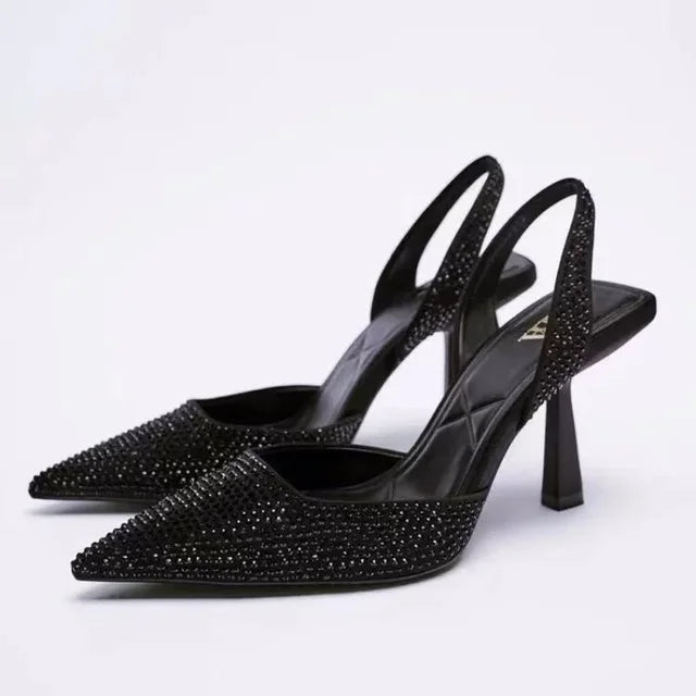 Black glitter slingback heels front view