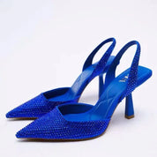 Blue glitter slingback heels angled view