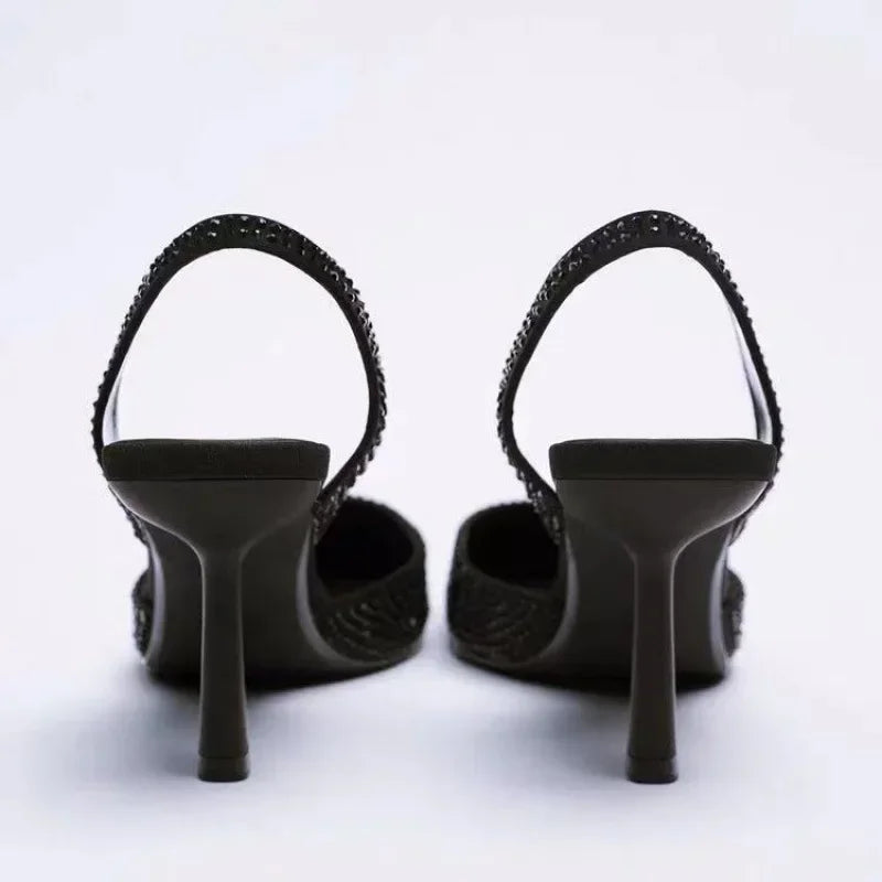 Black glitter slingback heels back view