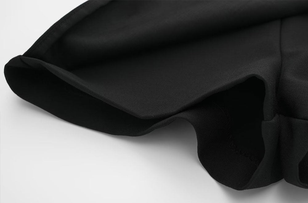 Korte broek met roklook zwart detailopname