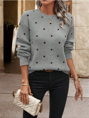 Light blue knit sweater with black polka dots three-quarter view