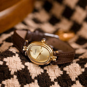 Horloge, gouden wijzerplaat, zwarte leren band, Dames