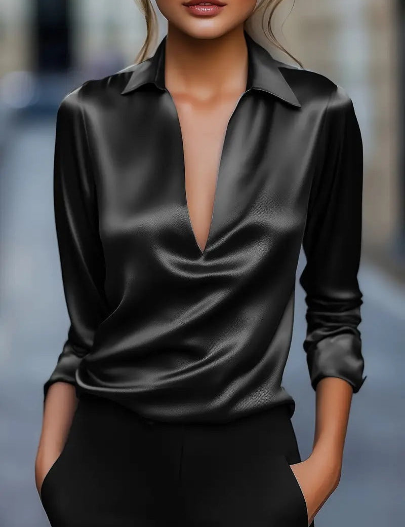 Black blouse with deep V-neck studio shot