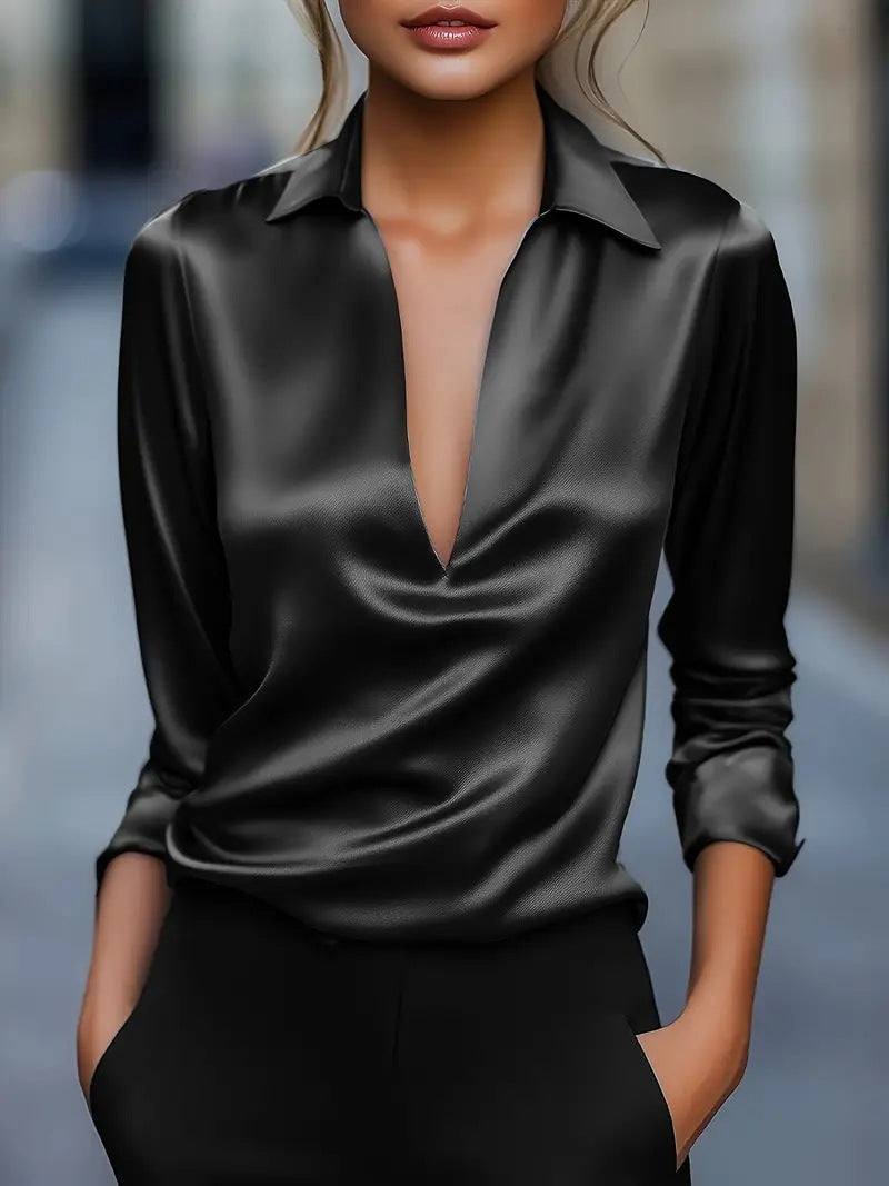 Black blouse with deep V-neck studio shot