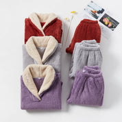 Fleece pajama set in gray, red, and purple, flat lay