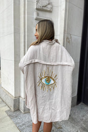 Oversized shirt with sequin eye detail, cream color, front view