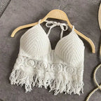 White crochet halter top with tassels, front view on hanger
