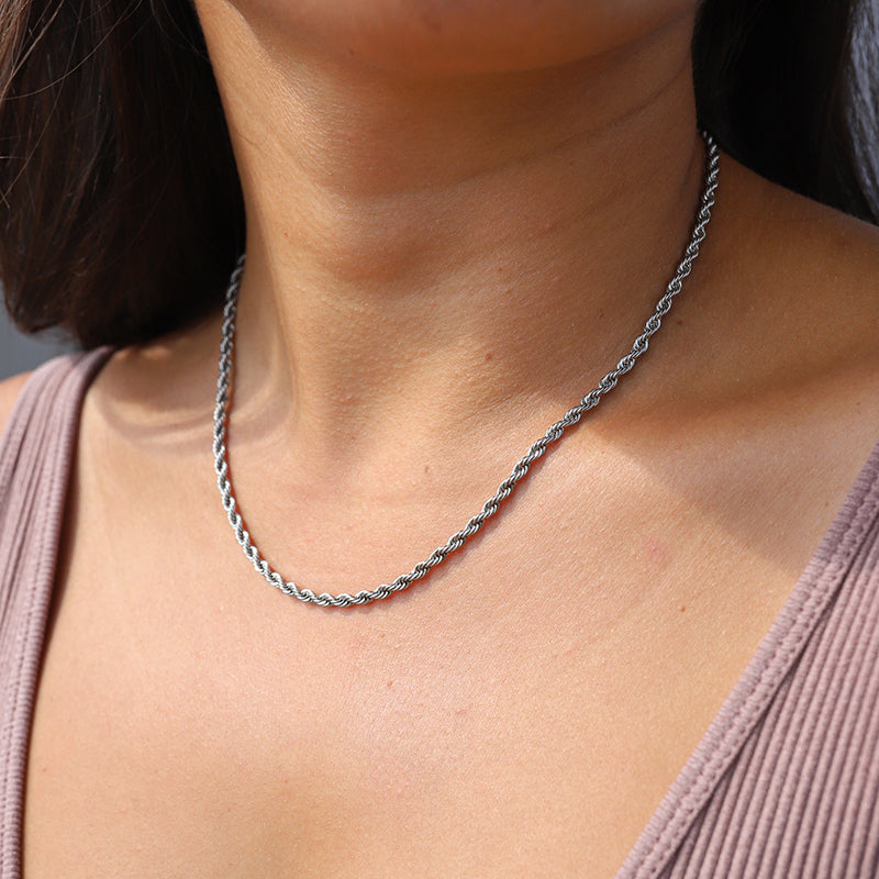 Silver twisted rope necklace worn on neck