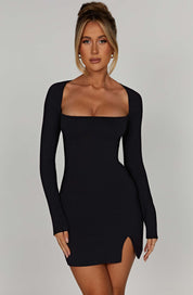 Black mini dress with square neckline and front side slit, front view
