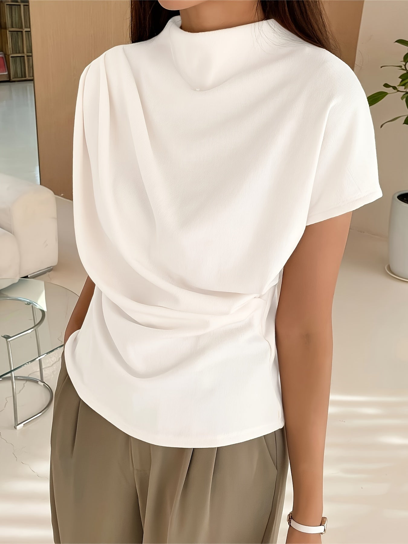 White draped-neck top with soft fabric texture front view