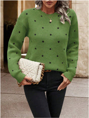 Green knit sweater with black polka dots front view