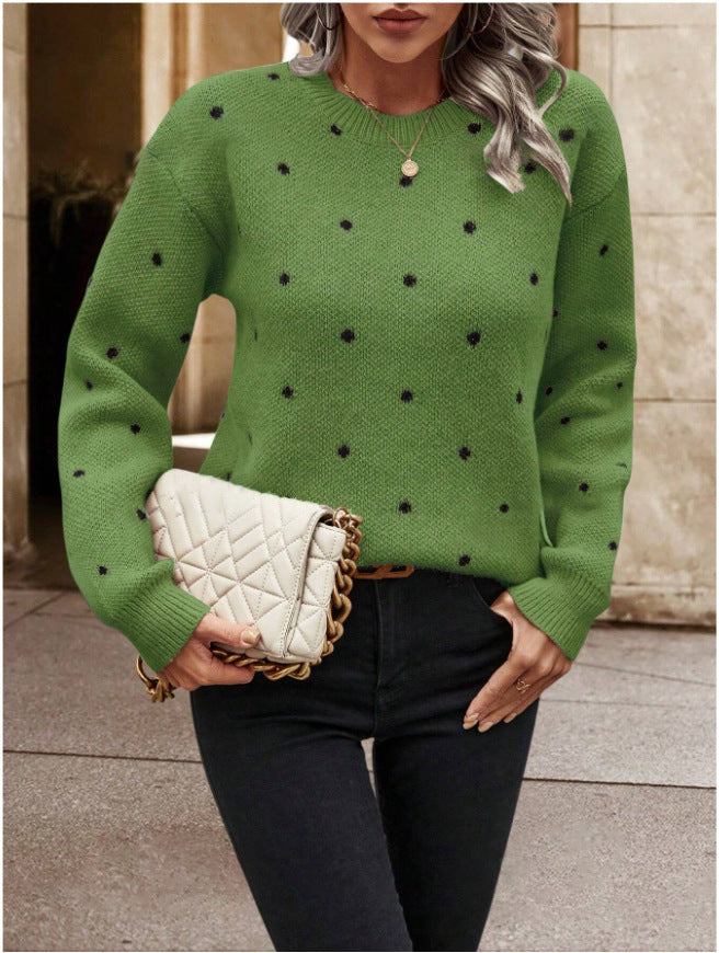 Green knit sweater with black polka dots front view
