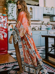 Maxi kimono dames bloemenprint oranje zijprofiel