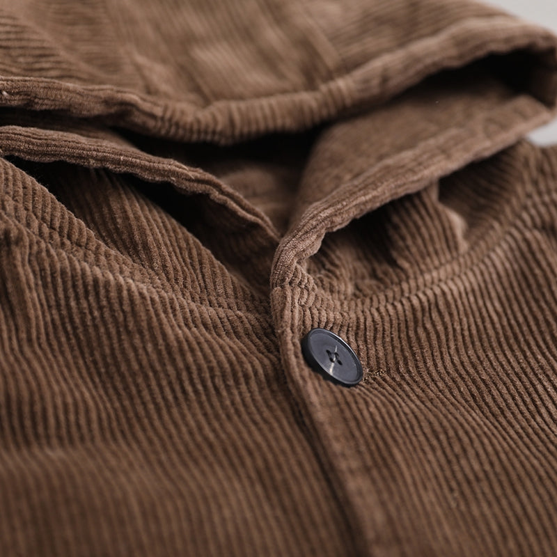 Brown corduroy hooded jacket button detail close-up