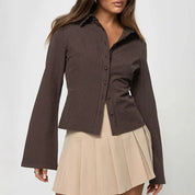 Brown striped shirt with bell sleeves front view