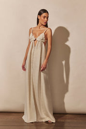 Light beige maxi dress with floral detail and front slit