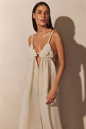 Cream maxi dress with floral embellishments and front slit
