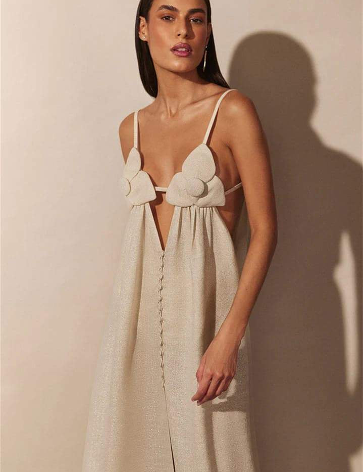 Cream maxi dress with floral embellishments and front slit