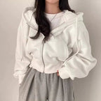 White zip-up hoodie with hood worn front view
