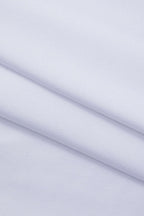 White long-sleeve crop top fabric close-up