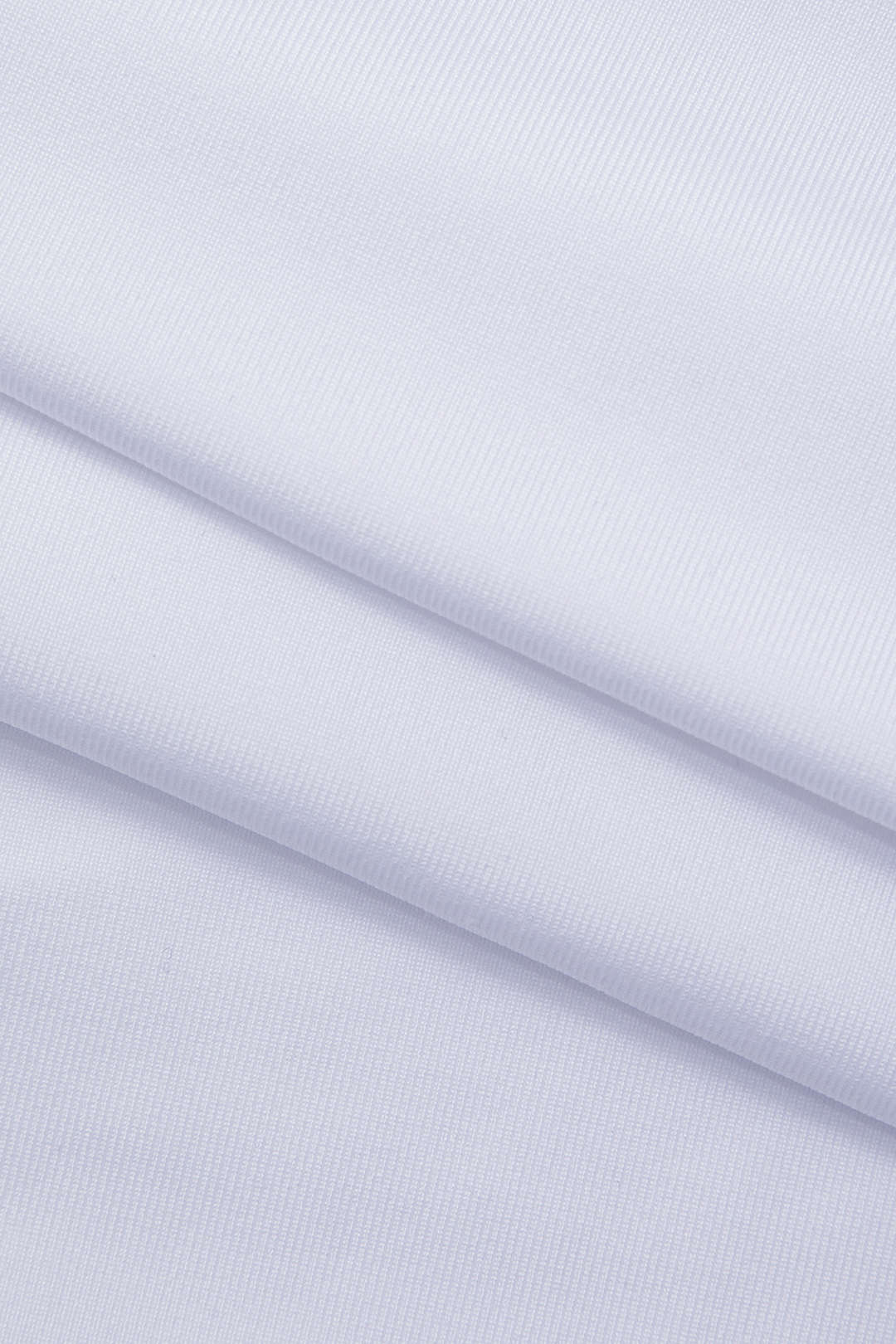 White long-sleeve crop top fabric close-up