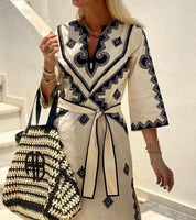 Midi dress beige with black embroidery close-up detail