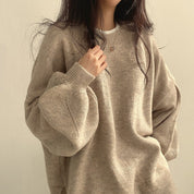 Trui beige met bolmouwen en ronde hals, vooruitschouw