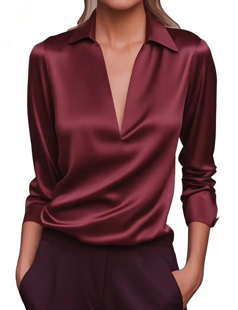 Red blouse with deep V-neck studio shot