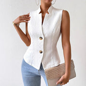 White structured gilet side view with textured pattern and clutch