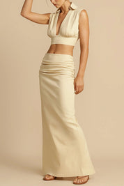 Beige ruched maxi skirt and crop top arm raised front view