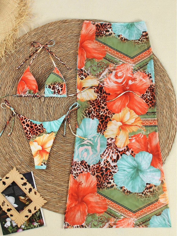 Bikini set with tropical print and starfish detail, flat lay