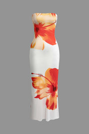 Maxi dress with orange hibiscus print on white background front view