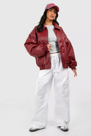 Oversized rode leren jas met witte details front view