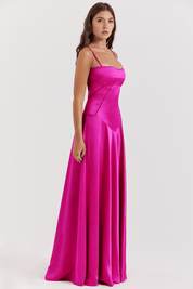 Fuchsia satin evening gown side view with hand on hip