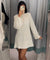 White sequin dress with black bow front view