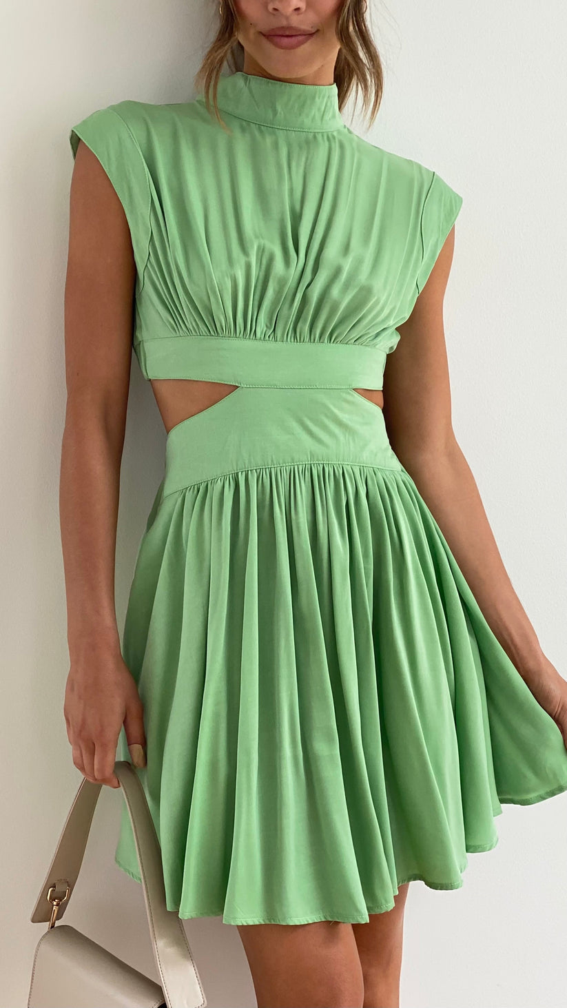 Lime green dress with cut-out details and pleated skirt front view