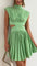 Lime green dress with cut-out details and pleated skirt front view