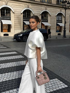 White silk blouse with puffed sleeves and matching pants three-quarter view