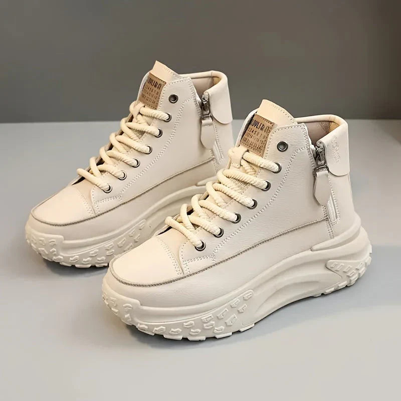 White high-top sneakers with platform sole angled view