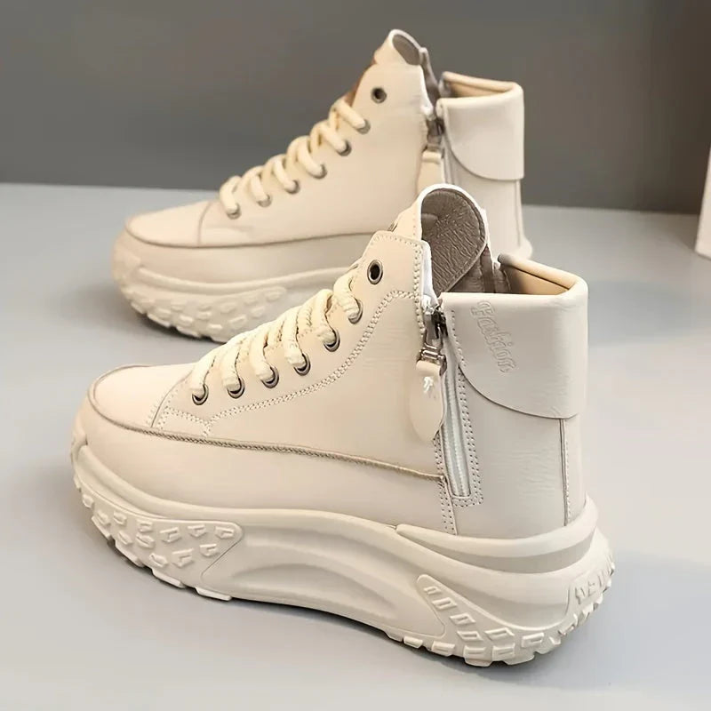White high-top sneakers with zipper and platform sole side view