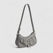 Shoulder bag gray with silver buckles side view