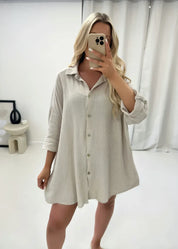 Oversized shirt with sequin eye detail, cream color, front view with buttons